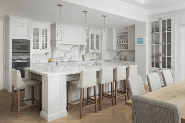 Bespoke hand-painted American-style kitchen with marble island and pendant lighting, handmade by Woodale Designs in Ireland.